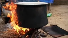 Traditional Cuisine Big Black Pot Cooking Food, Natural Fire With