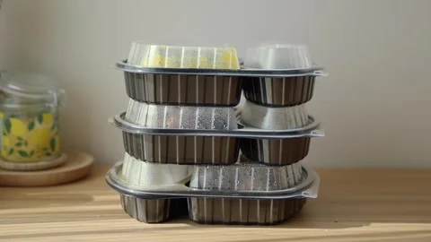 Meals stacked in containers on a kitchen table Stock Footage 340304154