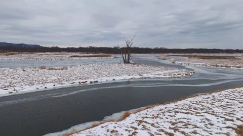Meandering ice-covered rivers form natural patterns through the Driftless Area Stock Footage 325830794