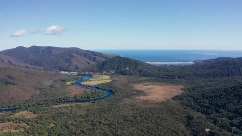 Meandering River Flowing into the Ocean Stock Footage 303082731