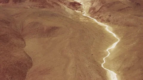 Meandering white salt river bed in a vast desert landscape aerial view Stock-Footage 333150929