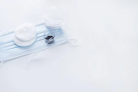 Means for coloring and correcting eyebrows on a blue medical mask. copy space Stock Photos