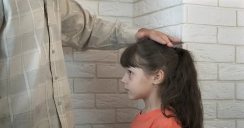 Measure the child's height. Stock Footage 163785311
