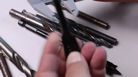 Measure the diameter of a drill with a digital caliper Stock Footage 314735350