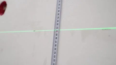Measure the height with a laser level. Stock Footage 240857914