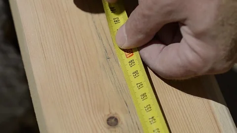 Measure, Mark and Cut a piece of Wood with Hand Saw Stock Footage 75673063