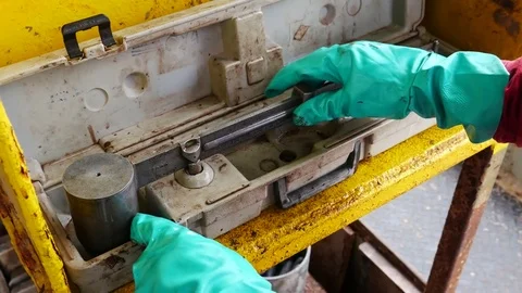 Measure mud density by using a mud balance Stock Footage 72985676