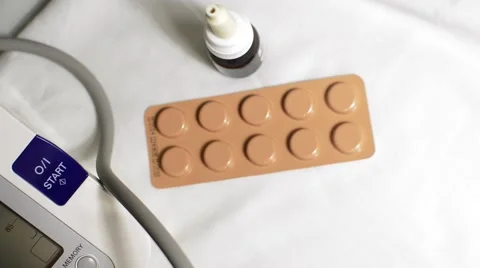 Measure the pressure. On the background of tablets and drug Stock Footage 55299075