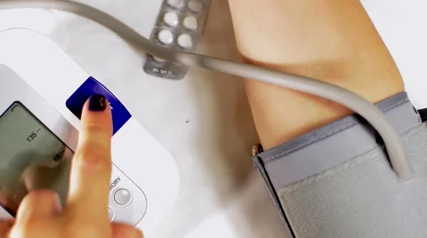 Measure the pressure. On the background of tablets and drug Stock Footage 55299076