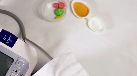 Measure the pressure. On the background of tablets and drug Stock Footage 55299079