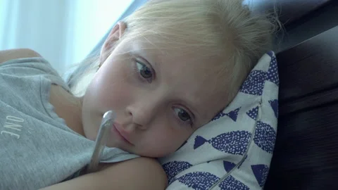 Measure the temperature of a sick child Stock Footage 147245422