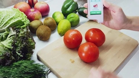 Measurement for the content of nitrates in tomato Stock Footage 82264929