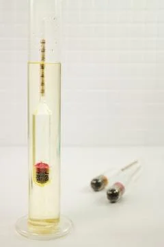 Measurement of solution density with a hydrometer in a lab Stock Photos