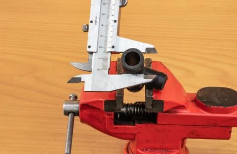 Measurement of tee diameter using calipers Stock Photos