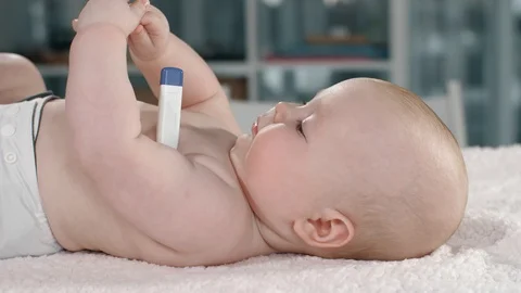 Measures the temperature of the child Stock Footage 87976339