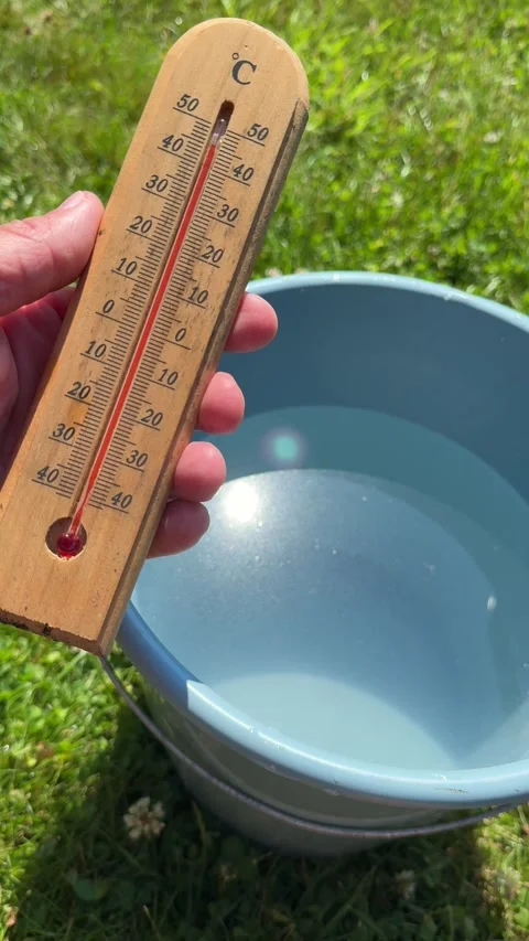 Measuring Air Temperature in Garden During Extreme Summer Heatwave Stock Footage 339665695