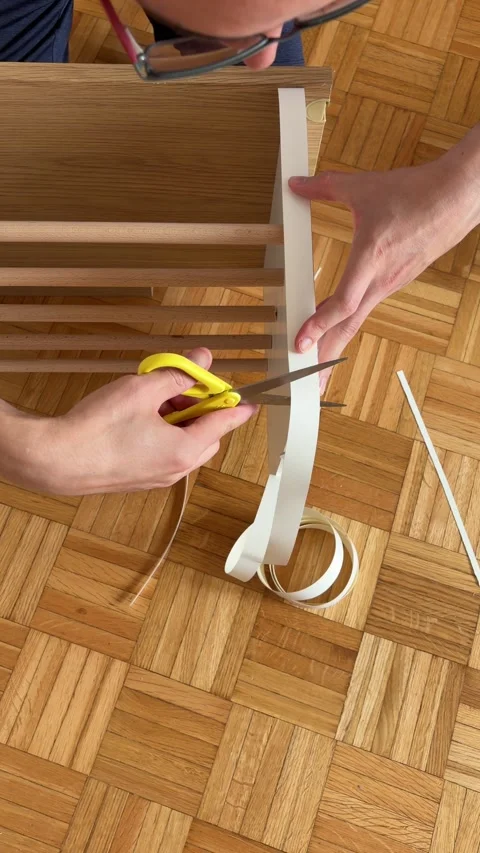 Measuring and cutting edge banding for laminated furniture board Stock Footage 340071945