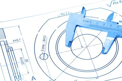 Measuring and drawing instruments and drawings on the table. Toning in trendy Stock Photos