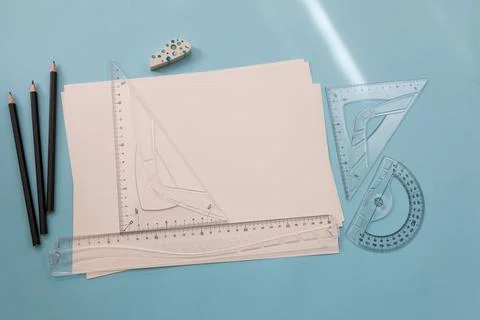 Measuring and drawing tools. A sheet of white paper, pencils, rulers on the desk Foto stock