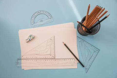 Measuring and drawing tools. A sheet of white paper, pencils, rulers on the desk Stock-Fotos