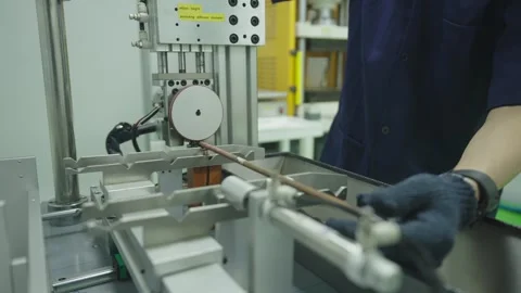 Measuring and setting up the Copper Brass Pipe into brass metal cutting machine Stock Footage 322113530