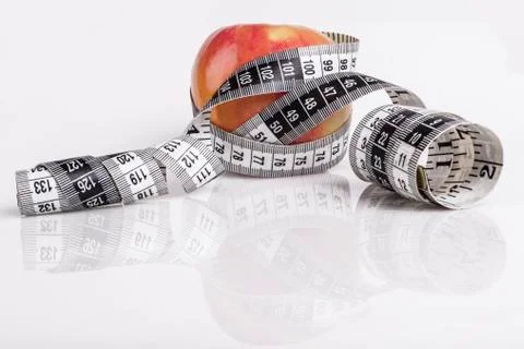 Measuring apple Stock Photos