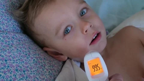 Measuring the body temperature of child Stock Footage 331154561