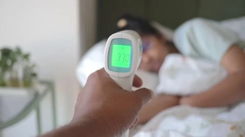 Measuring body temperature at home during illness Stock Footage 343709209