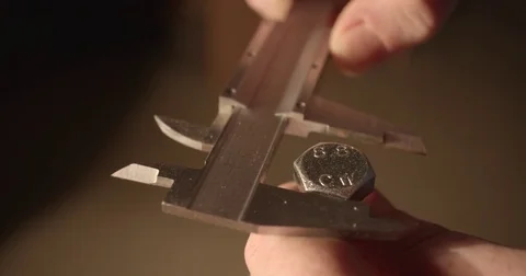 Measuring a bolt head with calipers. 4K (DCI) Stock Footage 81359065