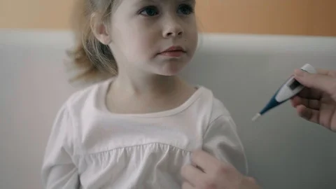 Measuring a Child's Temperature Stock Footage 105624764