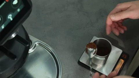 Measuring coffee mixture with steel container and table scale Video stock 306602256