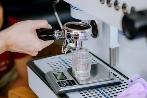 Measuring coffee with a scale.Measuring coffee affects the taste and aroma. Stock Photos