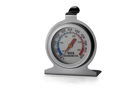 Measuring culinary magic with a classic oven thermometer for perfect cookin.. Stock Photos