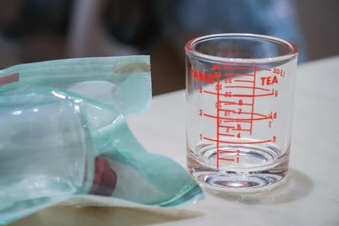 Measuring cup and liquid storage Stock Photos