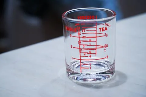 Measuring cup and liquid storage Stock Photos