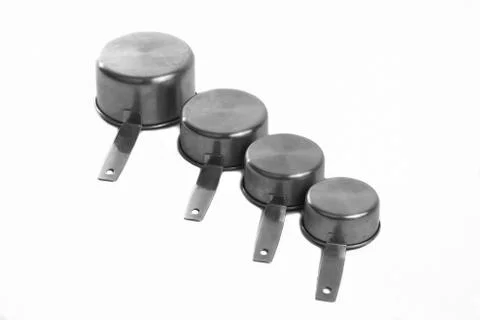 Measuring cups aligned at an angle Foto stock