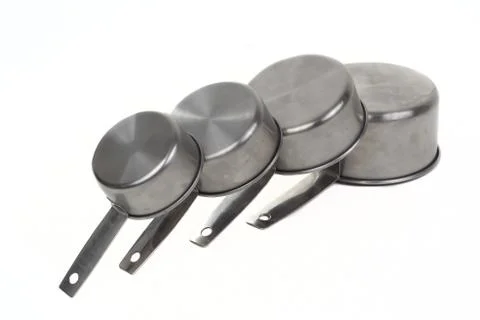 Measuring cups pilled side Stock Photos