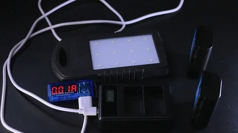 Measuring current consumption when charging batteries. Stock Footage 101244587