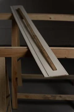 Measuring decorative wall panel board with folding ruler before cutting Stock Photos