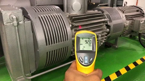 Measuring electrical motor temperature by Infrared Laser Thermometer Stock Footage 97710296