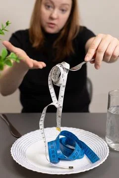Measuring Expectations in a Plate During a Mindful Eating Discussion at a Dining Stock Photos