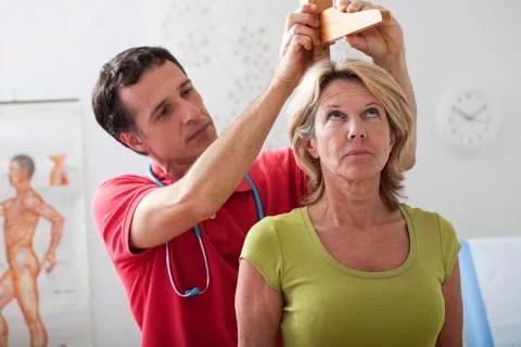 Measuring height, elderly person Stock Photos