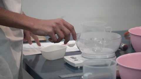 Measuring Ingredients in the Kitchen Stock Footage 317472394