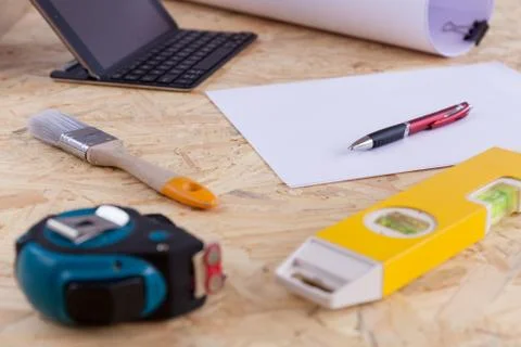 Measuring instruments on the working surface, drawings and contract Stock Photos