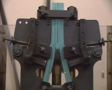 Measuring lateral strength of zip fastener, using a machine - front Video stock 46784033