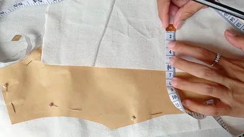 Measuring the material for a mask Stock Footage 149708817