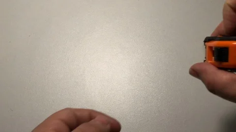 Measuring with meter rule tool Stock Footage 122104162