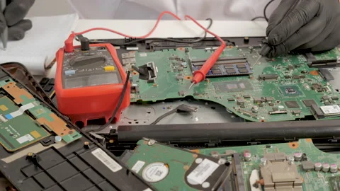 Measuring Motherboard Components with Multimeter Stock Footage 311570329