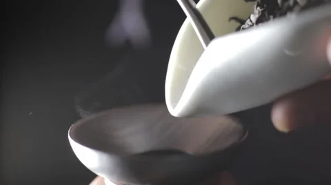 Measuring out the amount of tea leaves Stock Footage 56353733