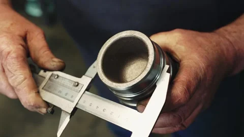 Measuring the outer diameter of a pipe with a caliper Stock Footage 284544910